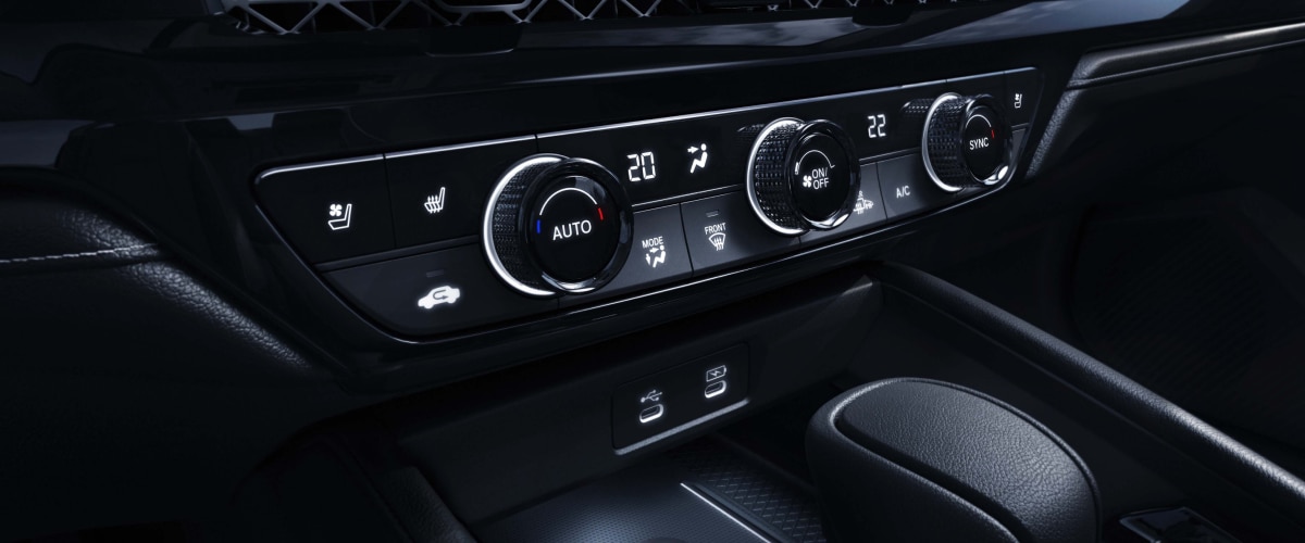 3/4 closeup view of the climate controls in the centre console.