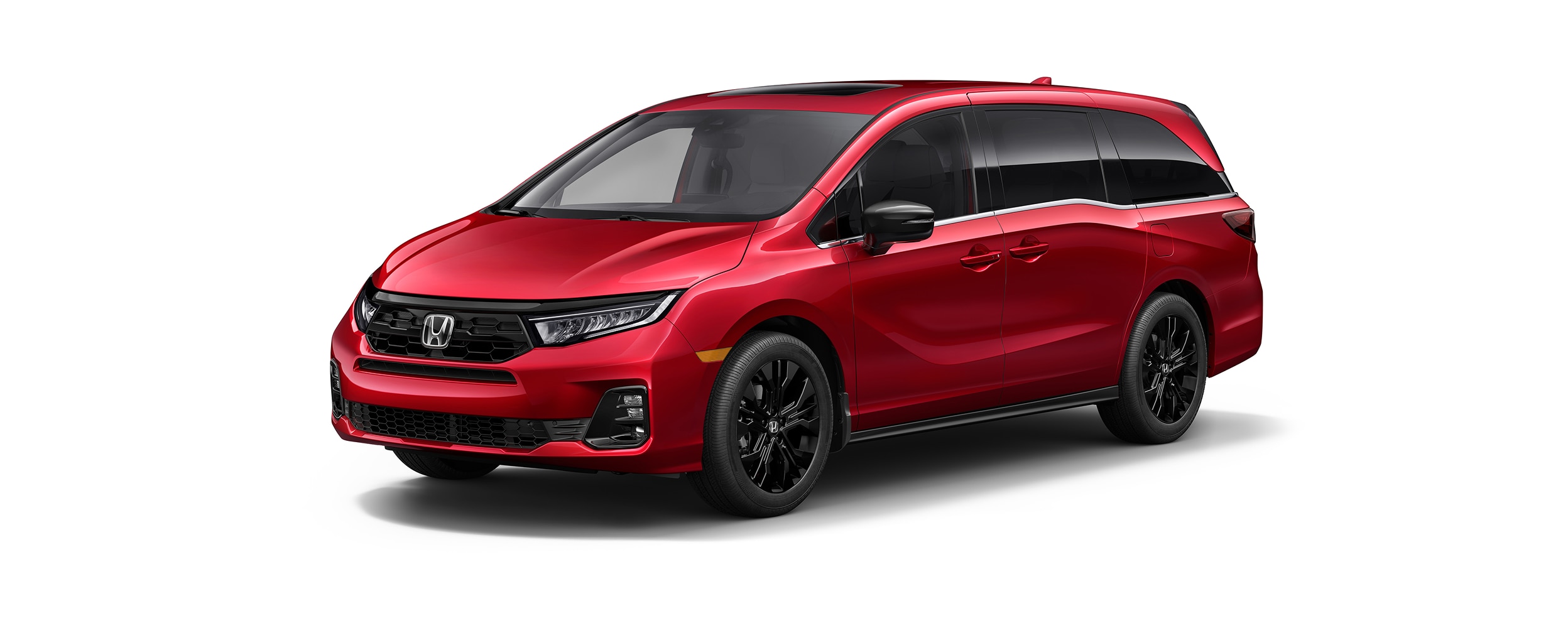 Vue latérale 3/4 avant d’une Odyssey rouge sur fond blanc.