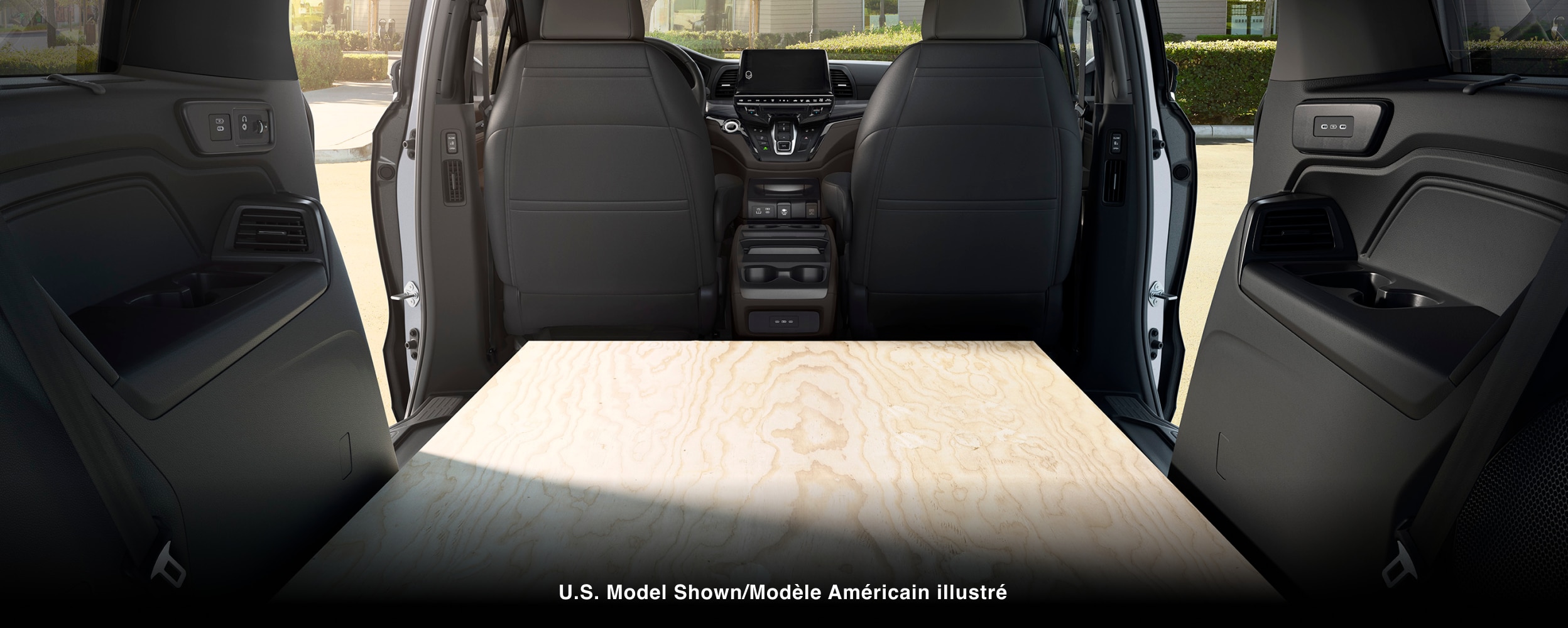 Interior view of Odyssey packed with sheets of plywood.