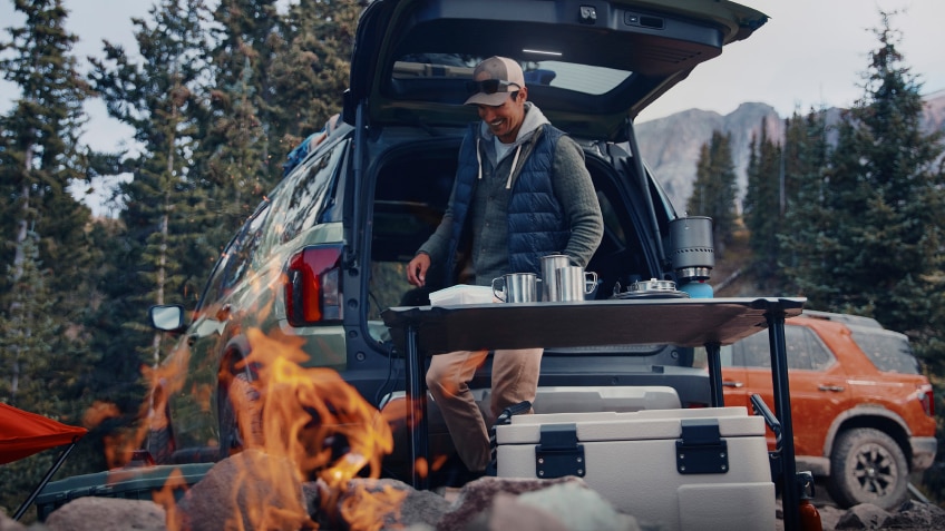 Image of a person camping with their Passport.