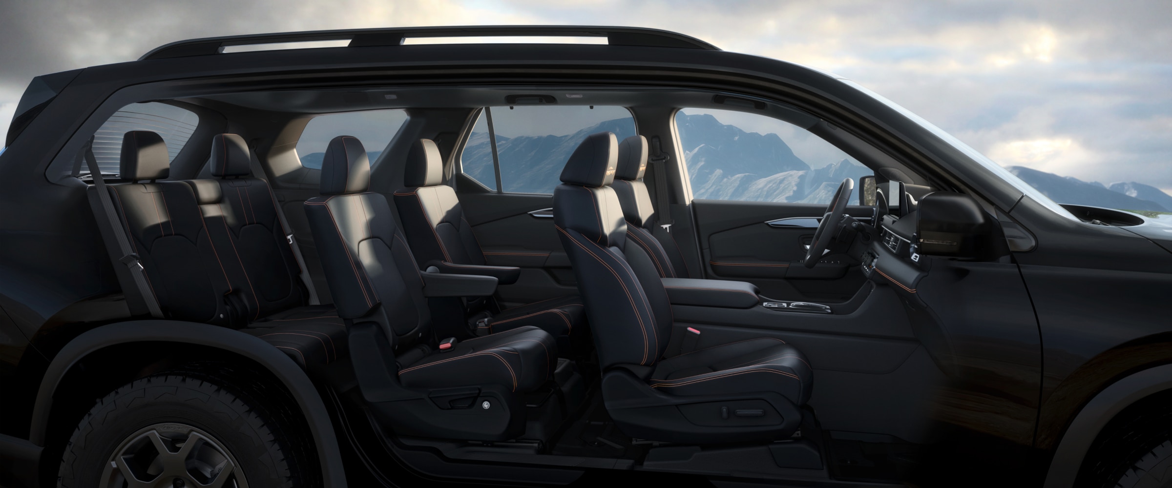 Side view of a Pilot with its doors removed, revealing the interior with three rows of seating.