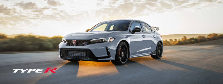 ¾ front view of a grey Type R on an outdoor road.