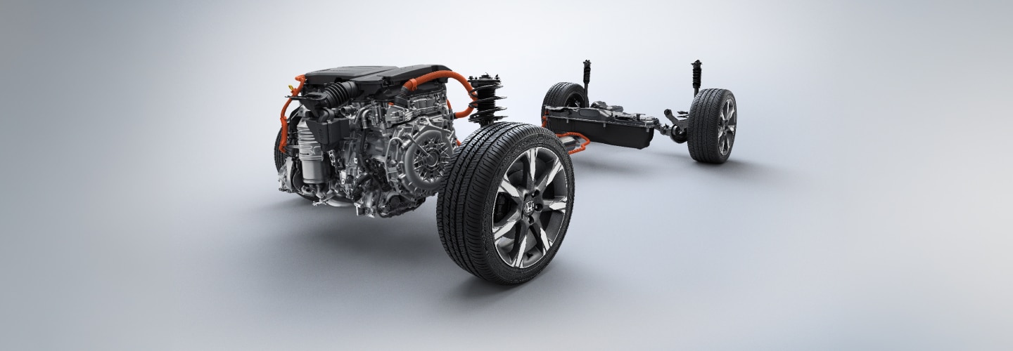 An unbuilt Honda showing only the engine and wheels is depicted against a grey neutral background.