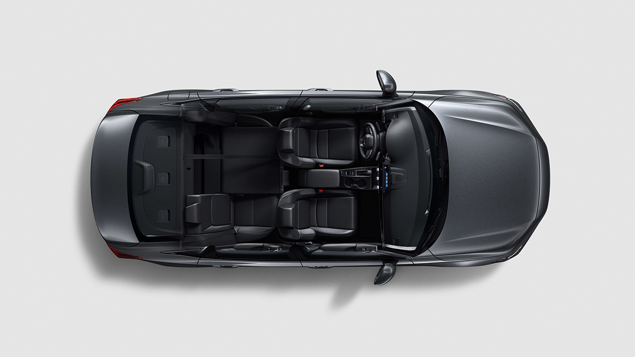 Bird’s eye view looking directly down at a grey Civic Sedan on white space with no roof, showing both rows of seating.