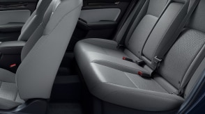 Side view of the rear and front seats of a Civic Sedan. 