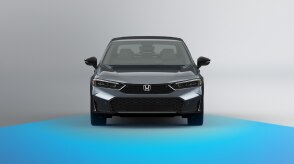 Wide front view of grey Civic Sedan on white space. Blue sensor waves emit from the front.