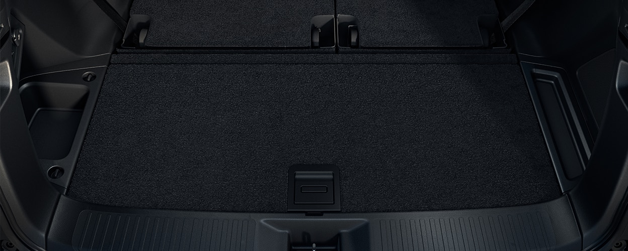 3/4 downward view of the open tailgate, showcasing the spacious trunk.