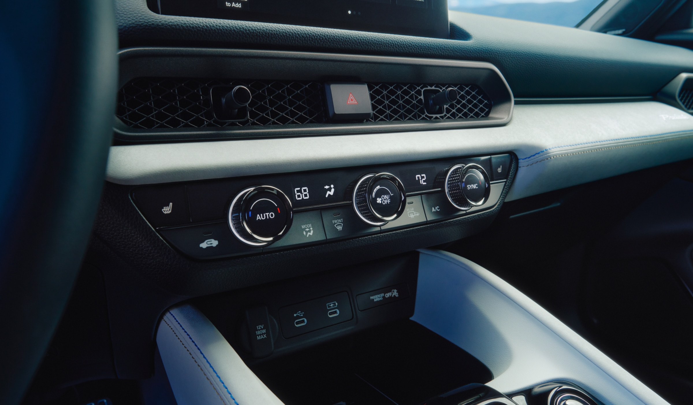 Closeup of climate controls in the Prelude's centre console.
