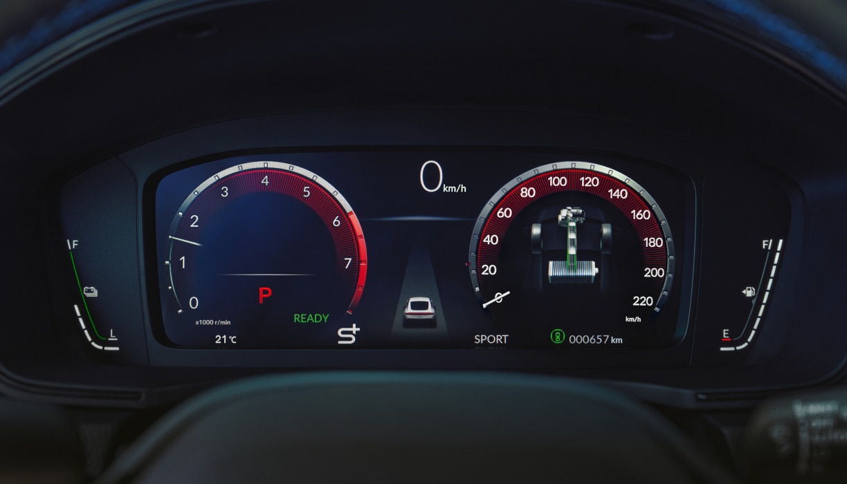 Closeup of Digital Instrument Cluster, showcasing speedometer, tachometer, odometer, and other info.