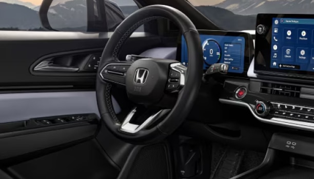 Interior shot of Honda Prologue featuring dashboard and steering wheel.