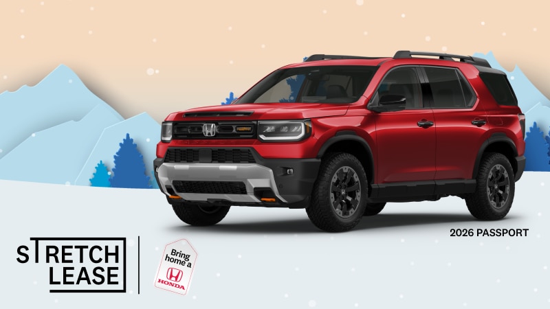 A red 2026 Passport Trailsport Touring with snowy mountains and trees in the background.